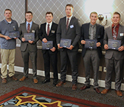 Students holding award